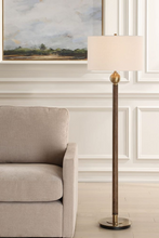 Load image into Gallery viewer, Floor lamp in a living room with a sofa and artwork on the wall.
