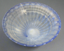 Load image into Gallery viewer, Blue glass bowl with a textured surface.
