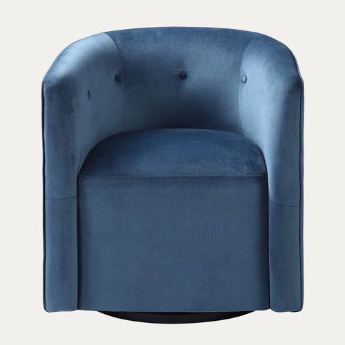 Blue velvet armchair on a white background